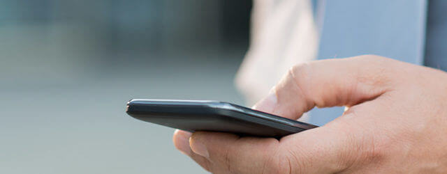 Close up of man using mobile phone